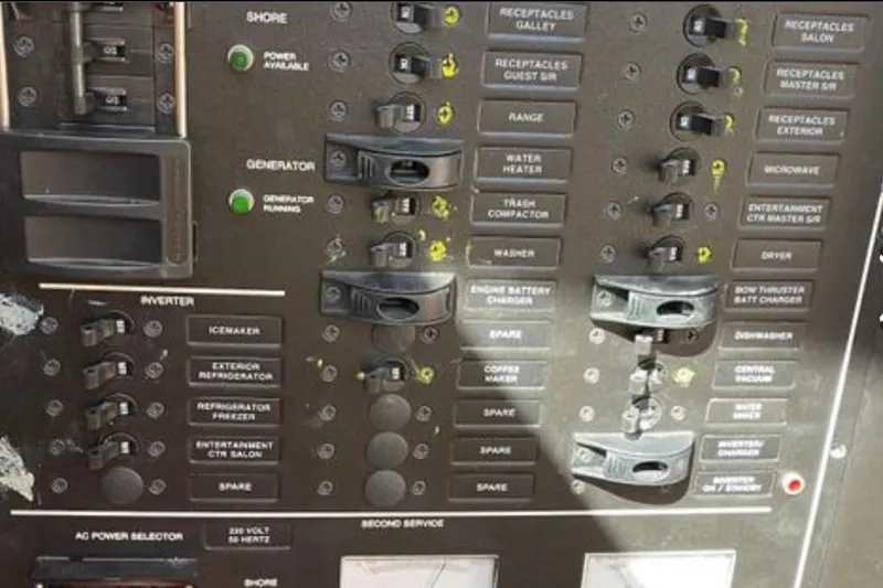 Slide: The Image of Control panel of a 2005 Carver 56 Voyager yacht with labeled switches and indicators. - 31