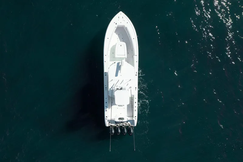 Slide: The Image of Overhead view of 2014 Yellowfin 39 Offshore boat on dark blue water. - 11