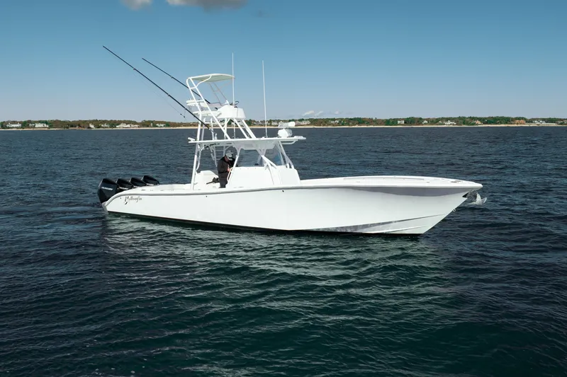 Slide: The Image of 2014 Yellowfin 39 Offshore boat on open water, featuring multiple outboard engines. - 14