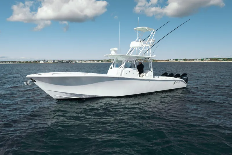 Slide: The Image of 2014 Yellowfin 39 Offshore boat on open water under a partly cloudy sky. - 16