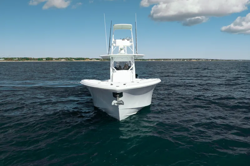 Slide: The Image of 2014 Yellowfin 39 Offshore boat cruising on open water under a clear sky. - 18