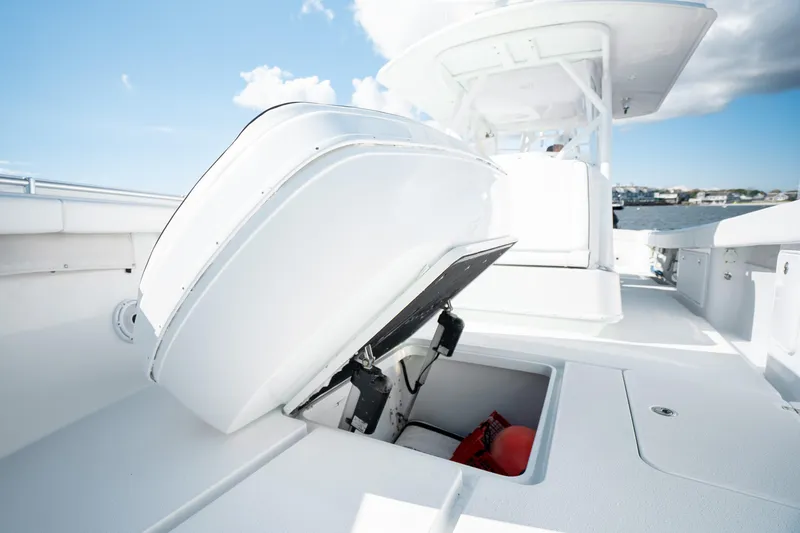 Slide: The Image of 2014 Yellowfin 39 Offshore boat deck with open storage compartment. - 27