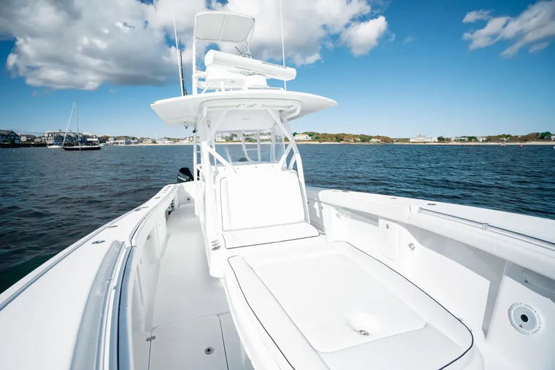 Slide: The Image of 2014 Yellowfin 39 Offshore boat on calm water under blue sky. - 28