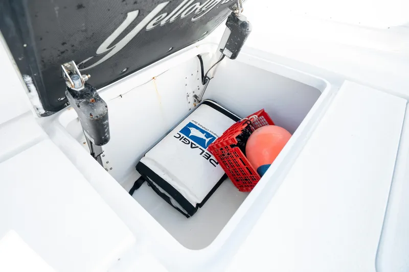 Slide: The Image of Storage compartment on a 2014 Yellowfin 39 Offshore boat with gear and equipment. - 30