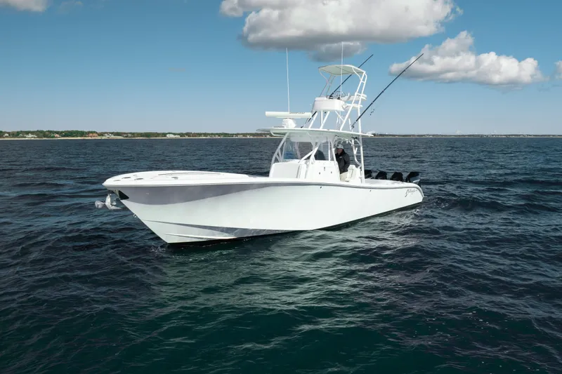 Slide: The Image of 2014 Yellowfin 39 Offshore boat on open water under blue sky. - 8