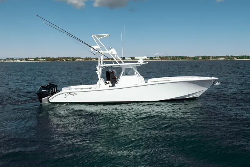 Slide: The Image of 2014 Yellowfin 39 Offshore boat on open water, side view. - 9