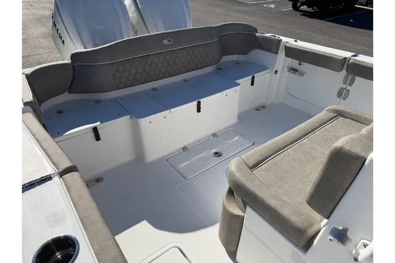 Slide: The Image of 2026 Sea Hunt Ultra 275 Coffin Box boat interior with cushioned seating and storage. - 14