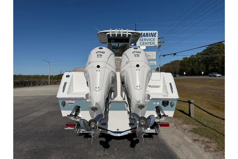 Slide: The Image of 2026 Sea Hunt Ultra 275 Coffin Box with twin 250 V6 engines at marine service center. - 9