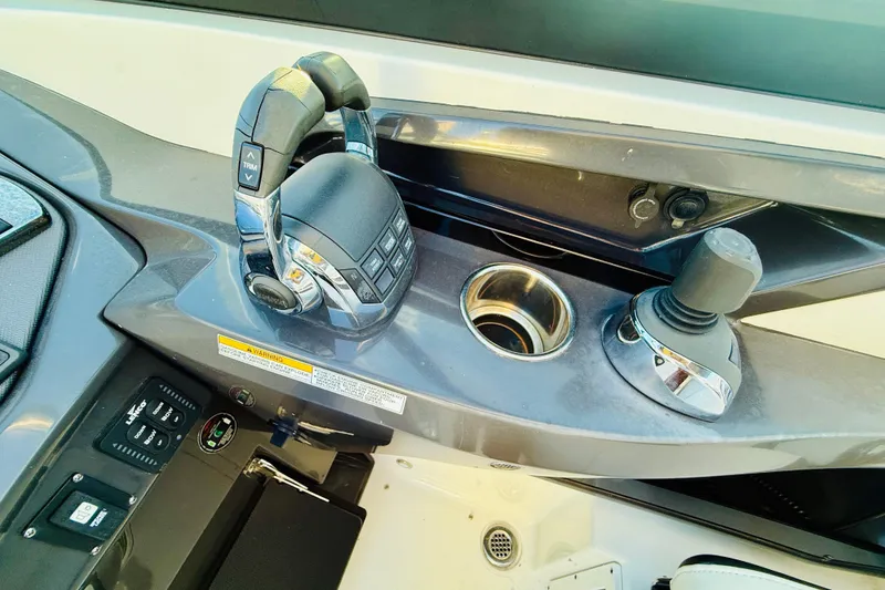 Slide: The Image of Control panel of 2020 Monterey 328SS Super Sport boat with joystick and throttle. - 10