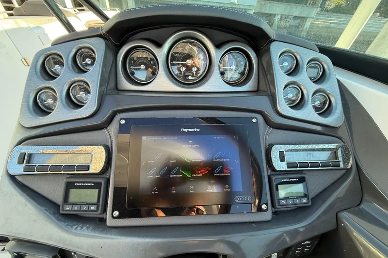 Slide: The Image of Dashboard of a 2020 Monterey 328SS Super Sport boat with gauges and touchscreen display. - 11