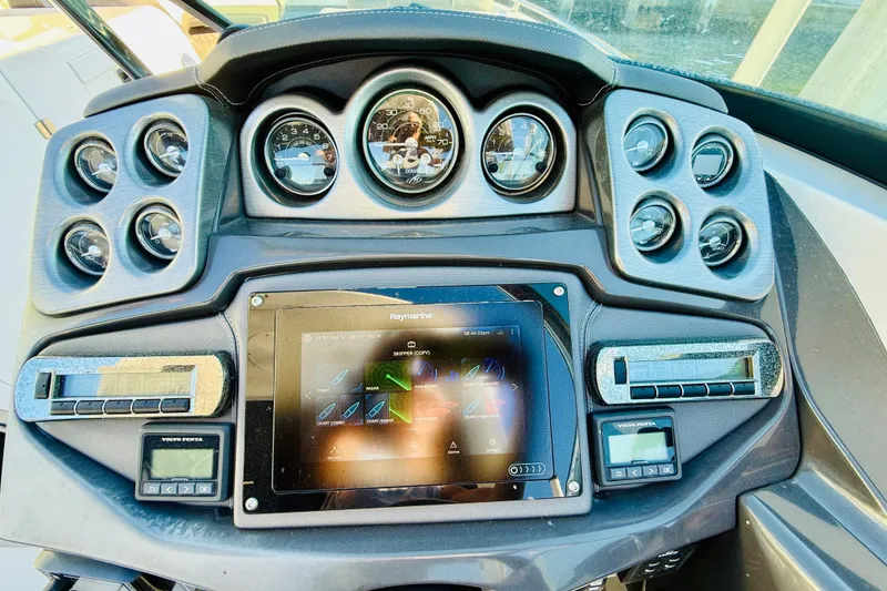 Slide: The Image of Dashboard of 2020 Monterey 328SS Super Sport boat with advanced controls and gauges. - 12