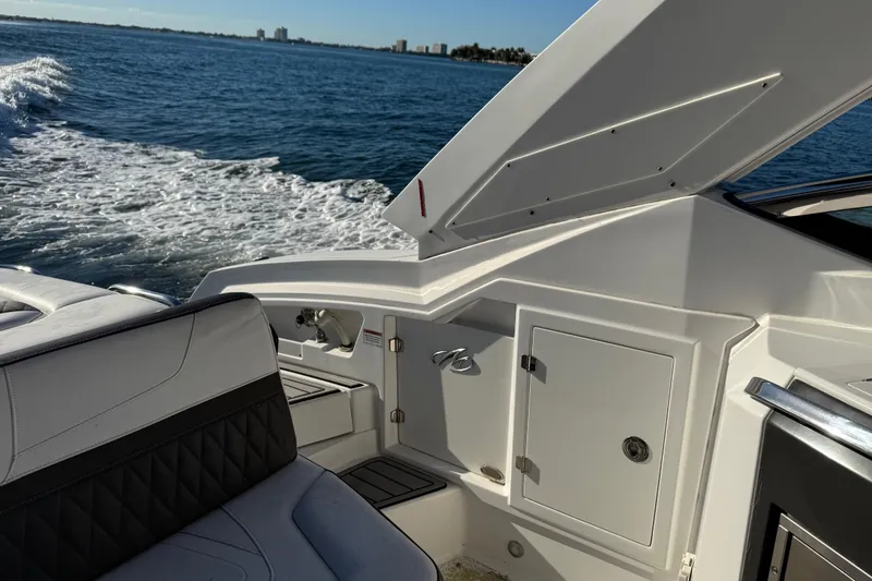 Slide: The Image of 2020 Monterey 328SS Super Sport boat interior with ocean view and seating area. - 14