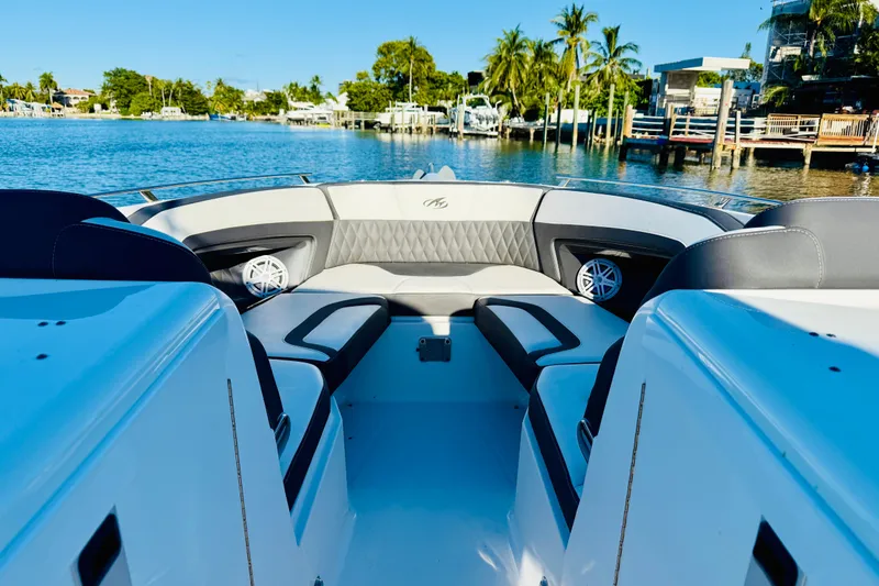 Slide: The Image of 2020 Monterey 328SS Super Sport boat interior with luxurious seating and waterfront view. - 22