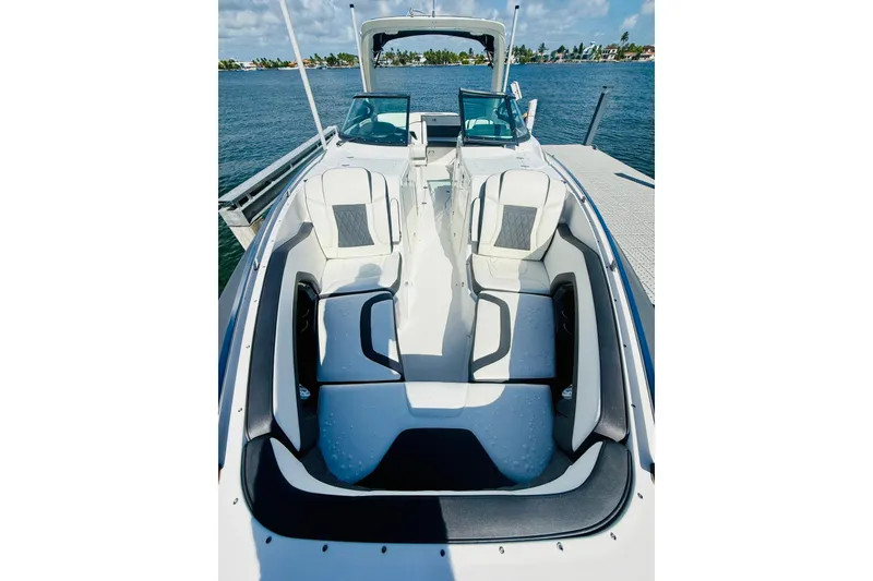 Slide: The Image of 2020 Monterey 328SS Super Sport boat with luxurious seating on a sunny day. - 23