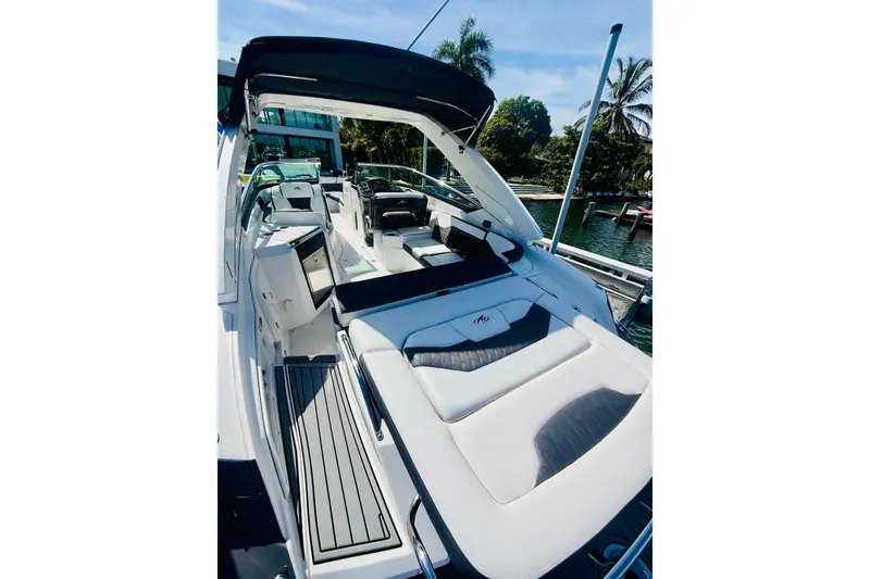 Slide: The Image of 2020 Monterey 328SS Super Sport boat with luxurious seating and sleek design. - 25
