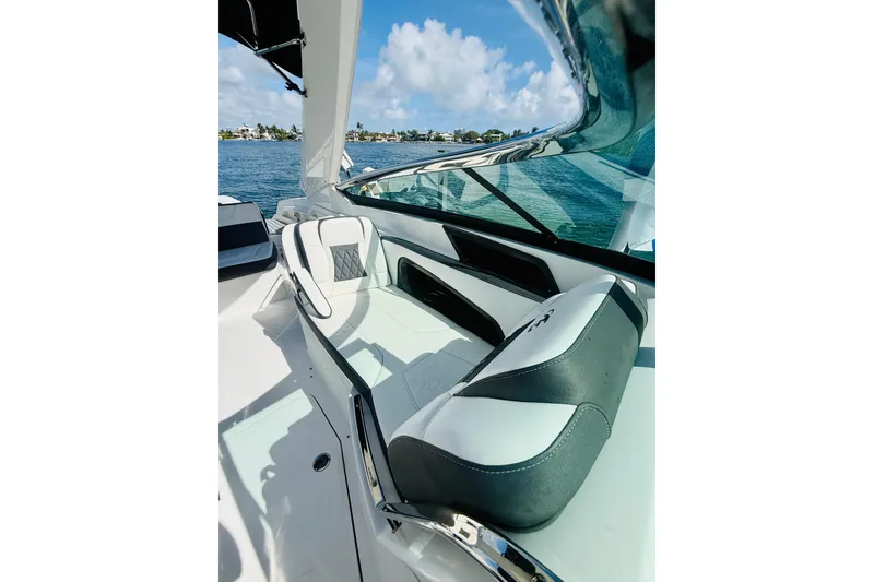 Slide: The Image of 2020 Monterey 328SS Super Sport boat interior with luxurious seating and ocean view. - 29