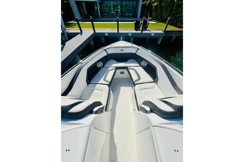 Slide: The Image of 2020 Monterey 328SS Super Sport boat interior with luxurious seating and waterfront view. - 34