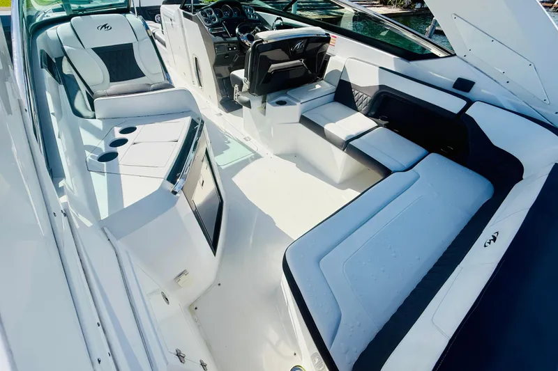 Slide: The Image of 2020 Monterey 328SS Super Sport boat interior with luxurious seating and modern dashboard. - 35