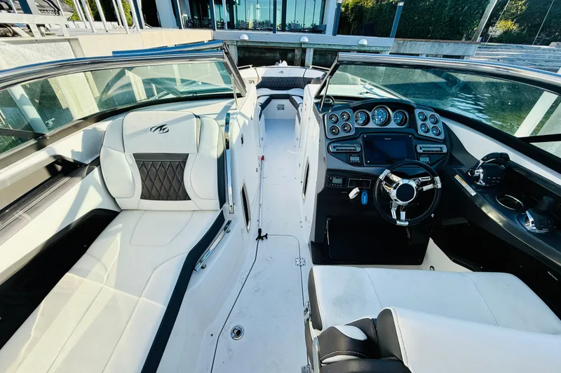 Slide: The Image of 2020 Monterey 328SS Super Sport boat interior with luxurious seating and modern dashboard. - 8