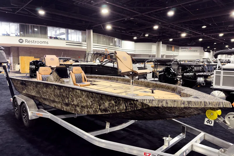 The Image of 2026 Excel EX203C Crappie & Bass boat on display at indoor exhibition. - 0