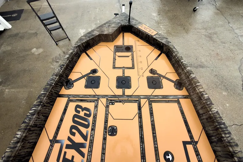 Slide: The Image of 2026 Excel EX203C Crappie & Bass boat with tan seats and camo accents. - 15