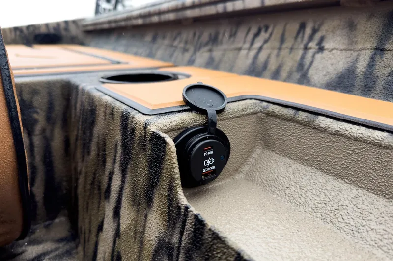 Slide: The Image of 2026 Excel EX203C Crappie & Bass boat interior with tan seats and storage compartments open. - 24