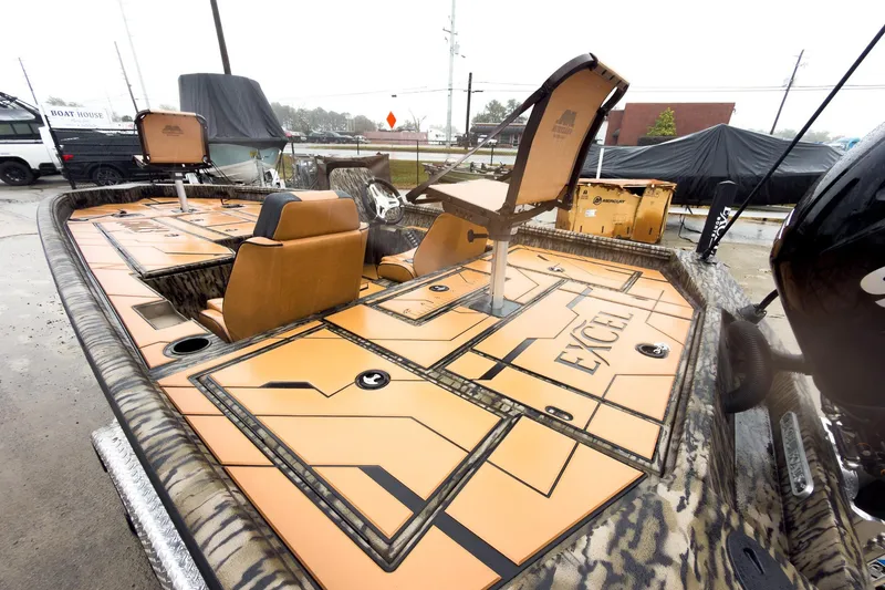 Slide: The Image of 2026 Excel EX203C Crappie & Bass boat with powerful engine, camo design, and trailer. - 8