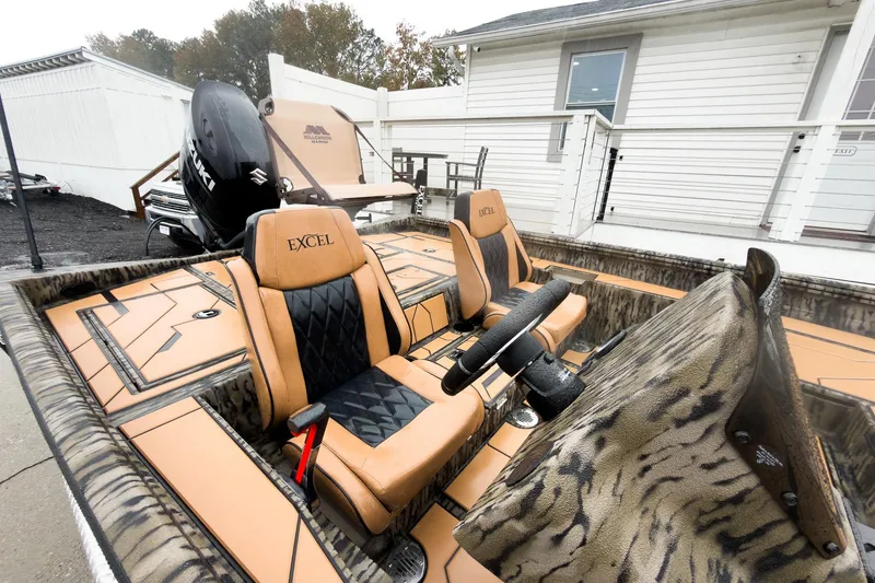 Slide: The Image of 2026 Excel EX203C Crappie & Bass boat with camo design and motor mount detail. - 9