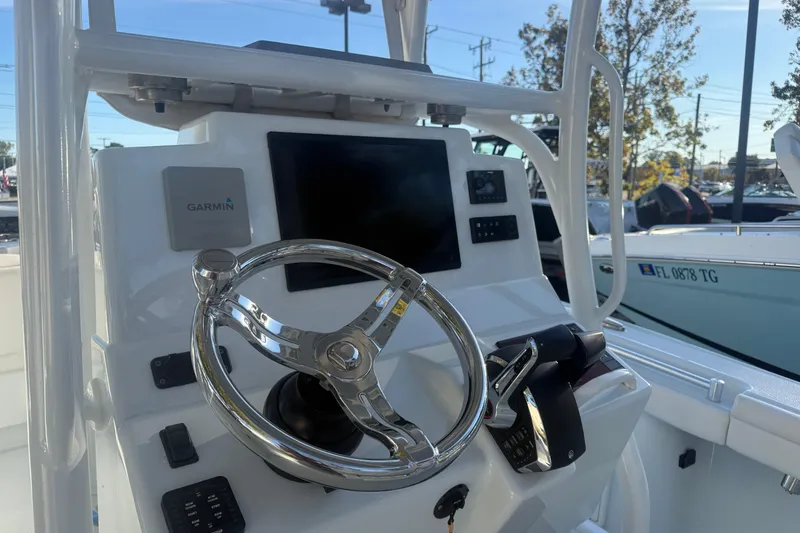 Slide: The Image of 2022 Yellowfin 26 Hybrid boat dashboard with Garmin navigation system. - 5