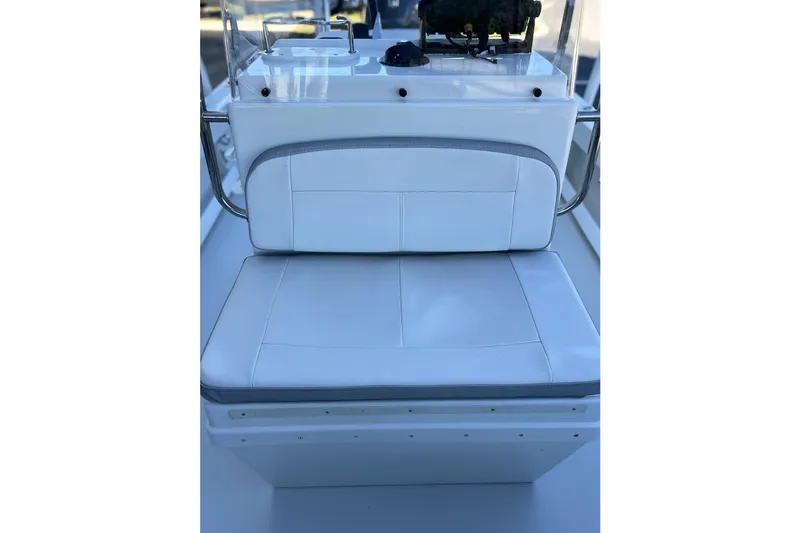 Slide: The Image of 2023 Parker 1801 Center Console boat seat with white cushioned upholstery. - 10
