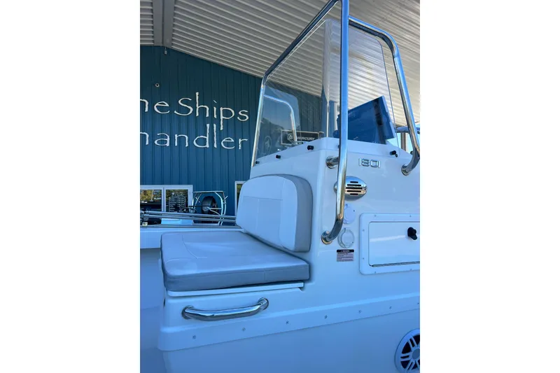 Slide: The Image of 2023 Parker 1801 Center Console boat with cushioned seating and stainless steel railings. - 13