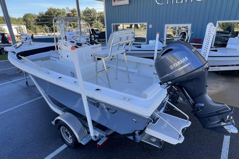 Slide: The Image of 2023 Parker 1801 Center Console boat with Yamaha outboard motor on trailer. - 2