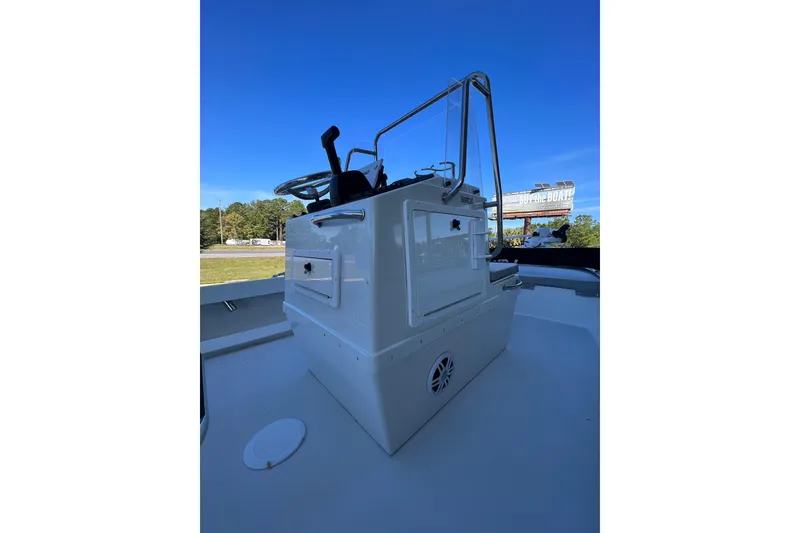 Slide: The Image of 2023 Parker 1801 Center Console boat with steering wheel and storage compartments. - 21