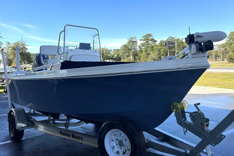 Slide: The Image of 2023 Parker 1801 Center Console boat on trailer, parked outdoors. - 22