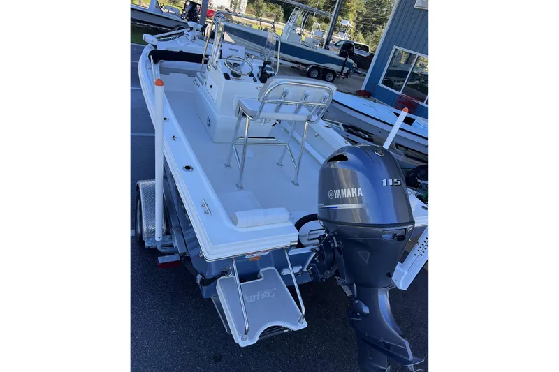 Slide: The Image of 2023 Parker 1801 Center Console boat with Yamaha 115 engine, parked outdoors. - 3