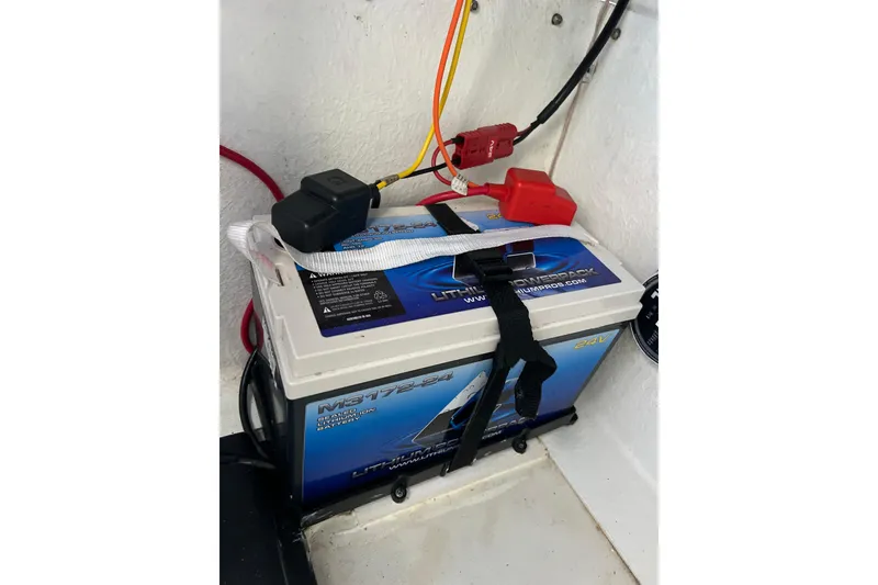 Slide: The Image of Battery setup in a 2023 Parker 1801 Center Console boat, featuring secure wiring connections. - 6