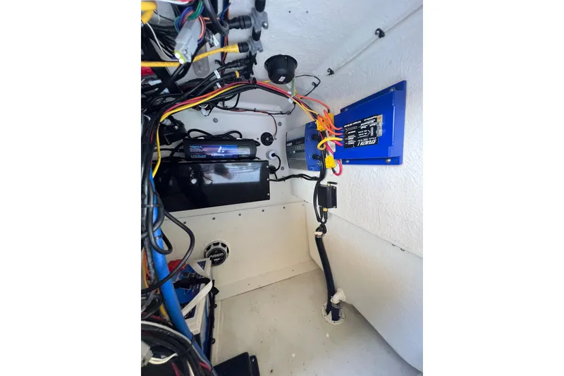 Slide: The Image of Interior wiring of 2023 Parker 1801 Center Console boat, showcasing electrical components. - 8