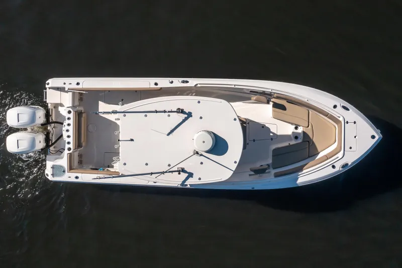 Slide: The Image of Overhead view of 2017 Sailfish 290 CC boat with dual engines on water. - 4