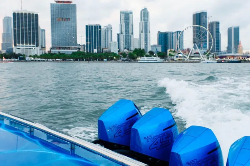 Slide: The Image of 2024 Cigarette 59 Tirranna boat cruising near city skyline with Ferris wheel. - 16