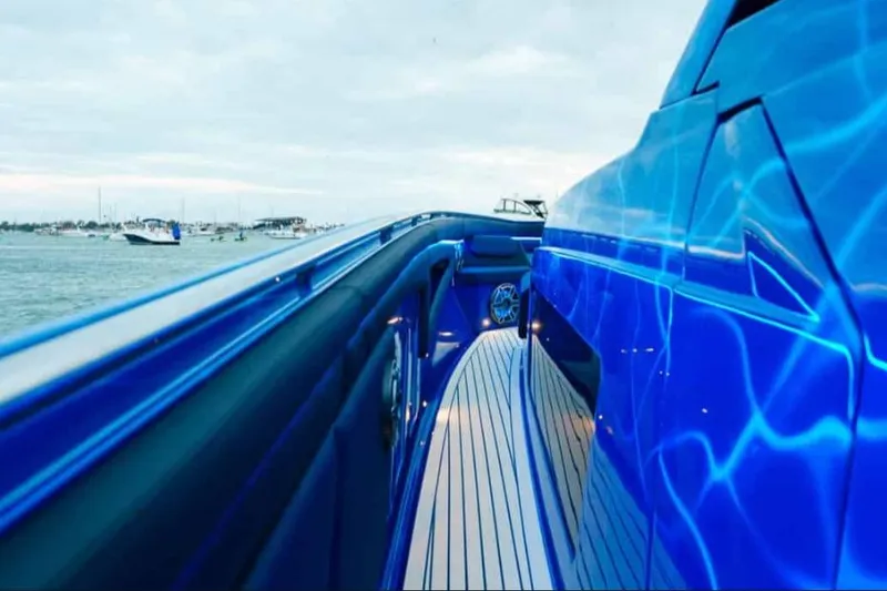 Slide: The Image of 2024 Cigarette 59 Tirranna luxury boat with sleek blue design on open water. - 26