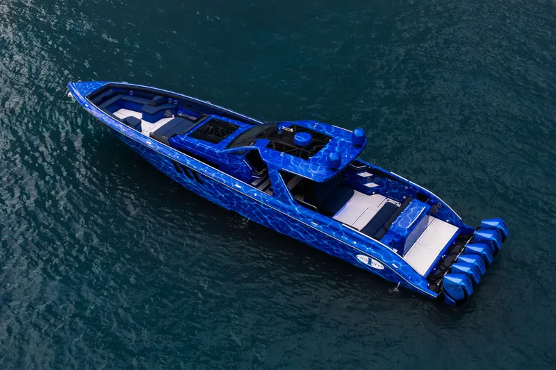 Slide: The Image of Manufacturer Provided Image: 2024 Cigarette 59 Tirranna luxury speedboat with blue camouflage design on water. - 3