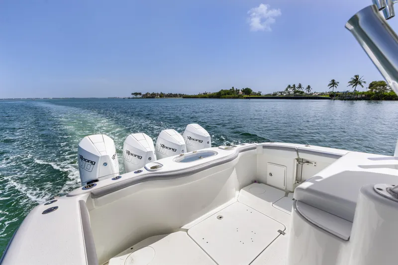 Slide: The Image of 2018 Yellowfin 42 Offshore boat cruising with four engines on a sunny day. - 13