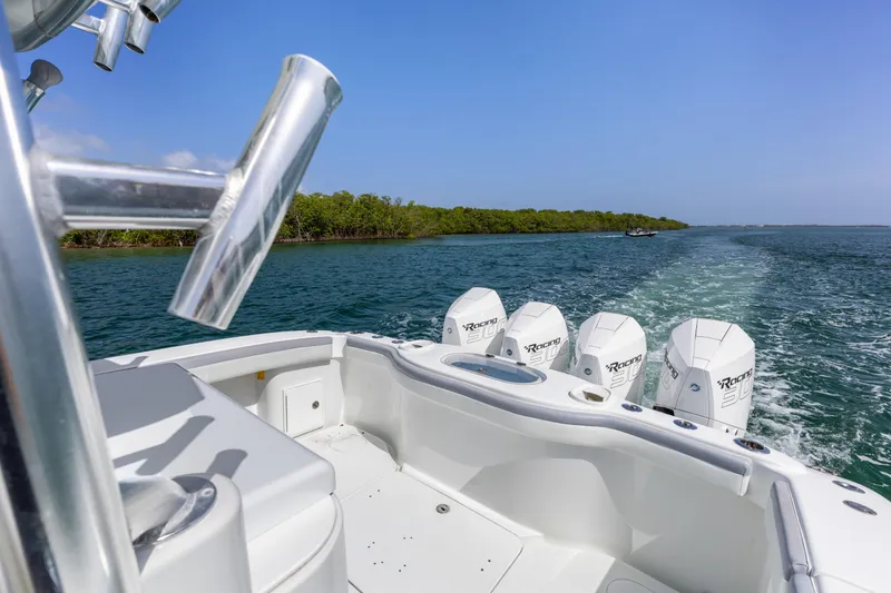 Slide: The Image of 2018 Yellowfin 42 Offshore boat cruising on open water with powerful engines. - 14