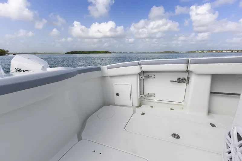 Slide: The Image of 2018 Yellowfin 42 Offshore boat deck with ocean view and clear skies. - 17