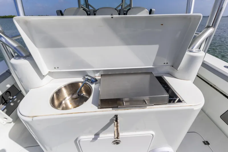 Slide: The Image of 2018 Yellowfin 42 Offshore boat with sink and grill station. - 20