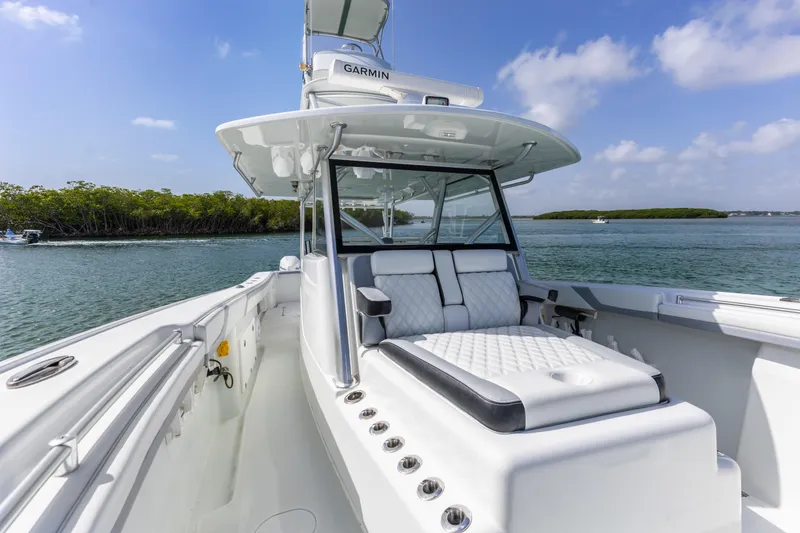 Slide: The Image of 2018 Yellowfin 42 Offshore boat with luxurious seating on calm waters. - 28