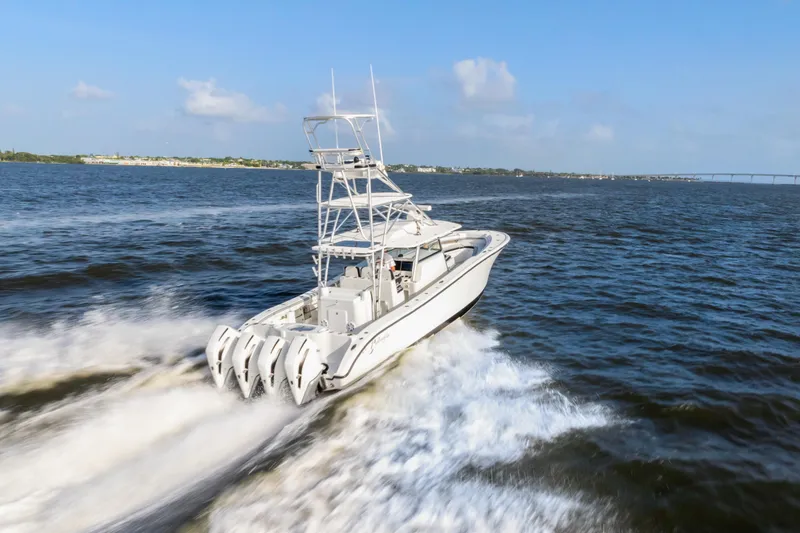 Slide: The Image of 2018 Yellowfin 42 Offshore boat cruising on open water, showcasing powerful engines. - 3
