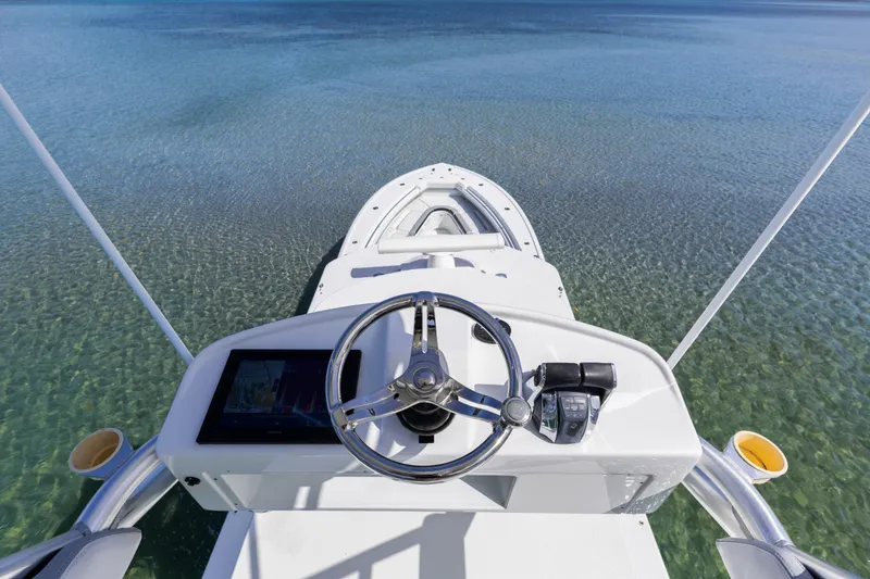 Slide: The Image of 2018 Yellowfin 42 Offshore boat steering console on clear water. - 39