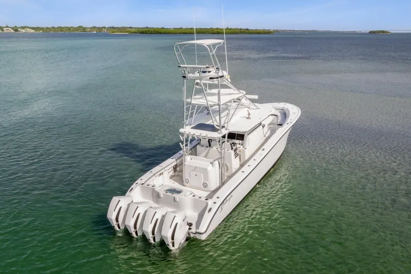 Slide: The Image of 2018 Yellowfin 42 Offshore boat with four engines on calm water. - 5