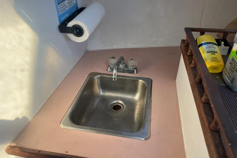 Slide: The Image of Small sink area on a 1995 Young Brothers 38 Fly Bridge boat. - 15